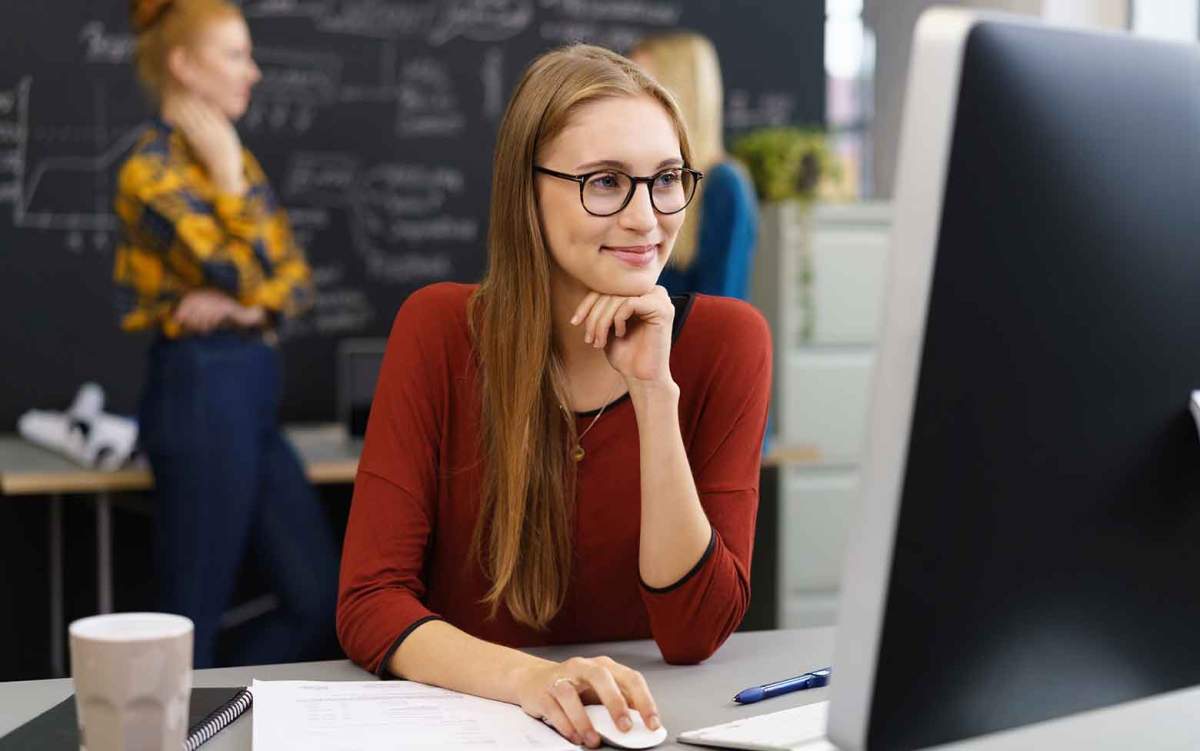 Woman working at a computer in a modern office